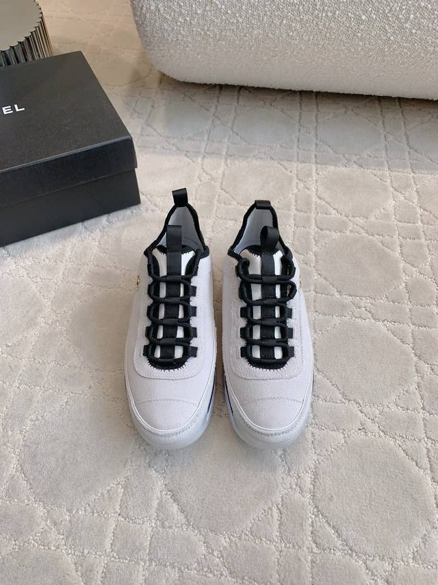 Chane* Classic thick-soled sneakers in the classic black and white panda colorwa Chane* Classic thick-soled sneakers in the classic black and white panda colorwa