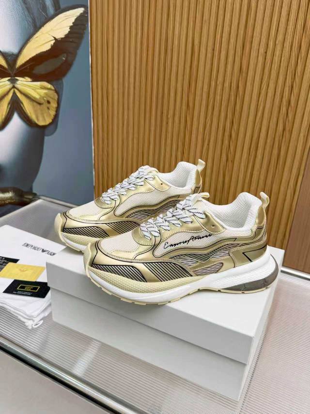 New Armani sneakers, featuring a low-top lace-up design. The patchwork upper ad New Armani sneakers, featuring a low-top lace-up design. The patchwork upper ad